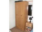 Pine effect wooden wardrobe. Good Condition,  Two doors, ....